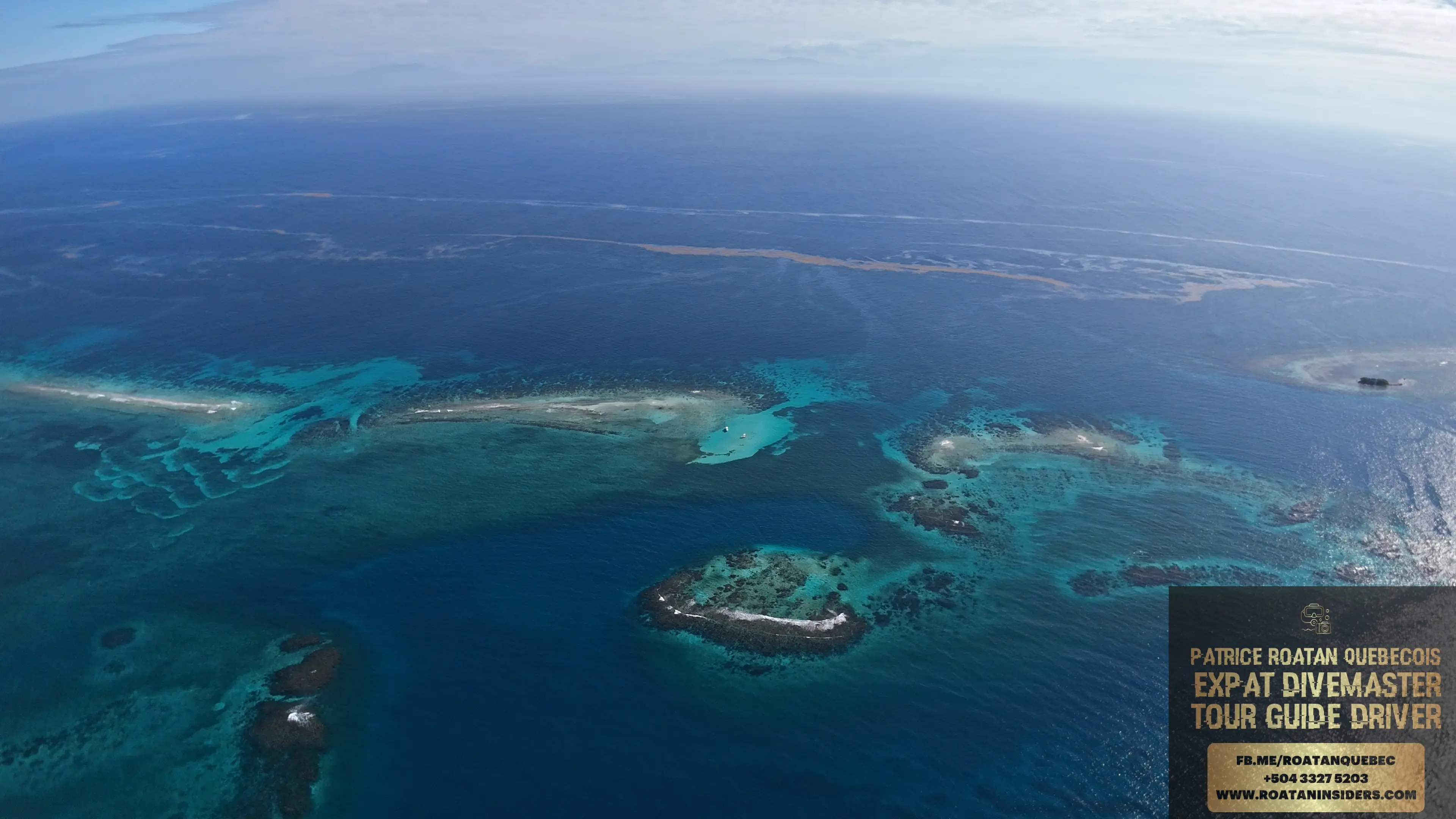 Pigeon Cay and the reef by drone, with the island behind