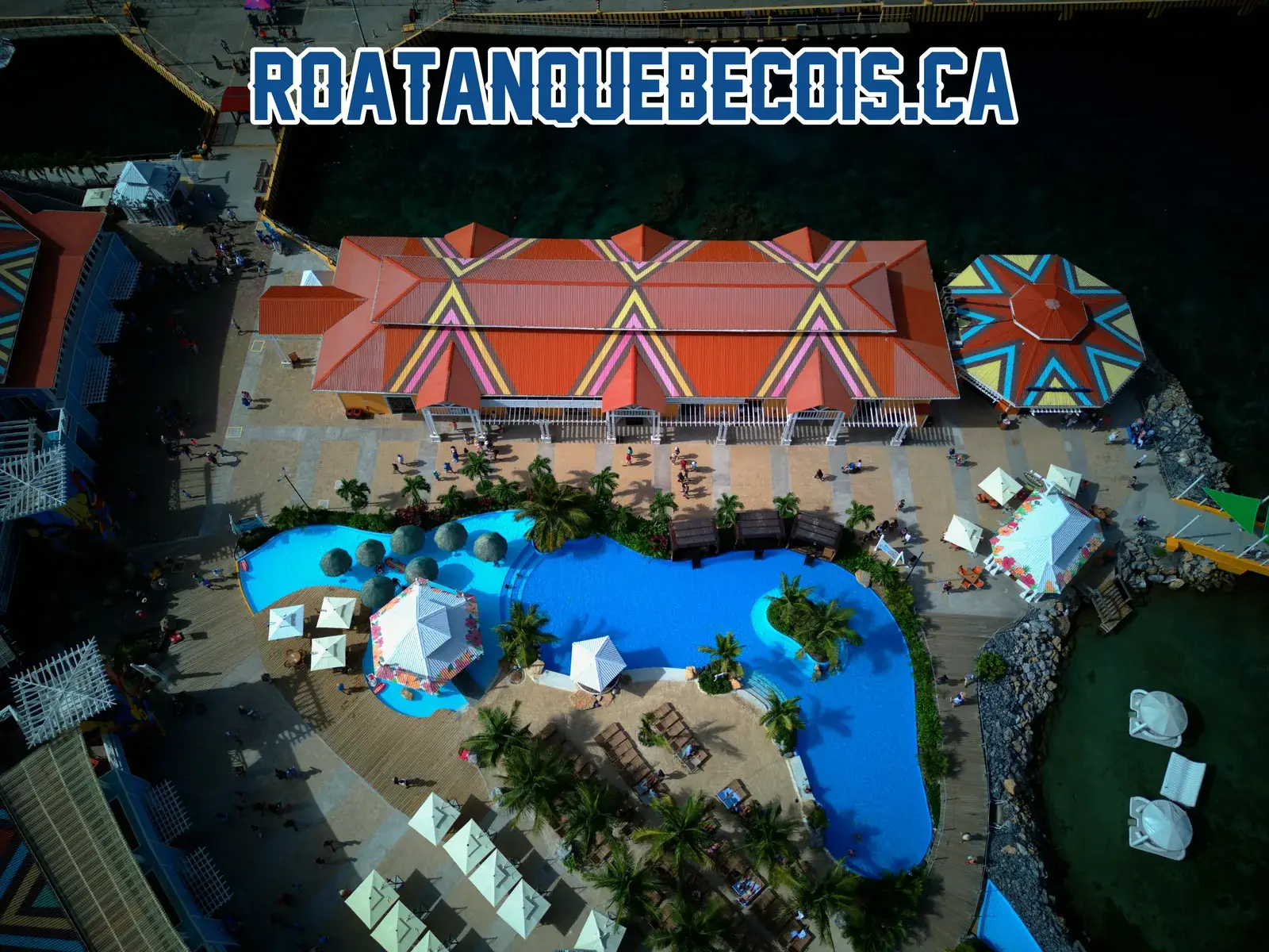 The long terminal building at Port of Roatán and its pool, seen straight down from above