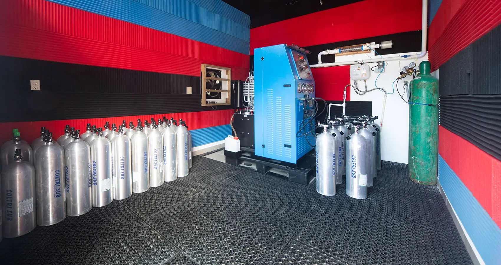 Tank fill room at the Naboo dive center, with tanks and a professional compressor