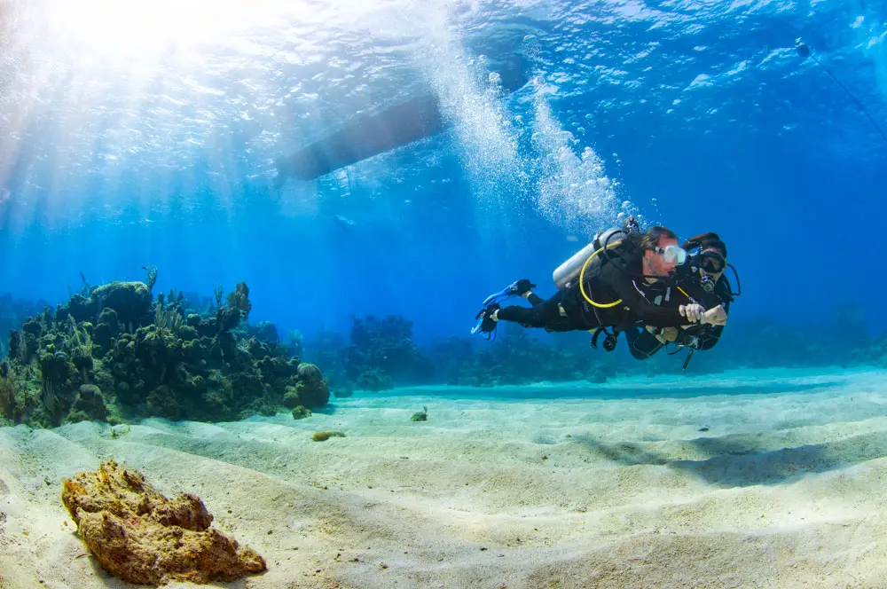 Divers gearing up for a tank dive organized by Naboo Resort & Dive Center
