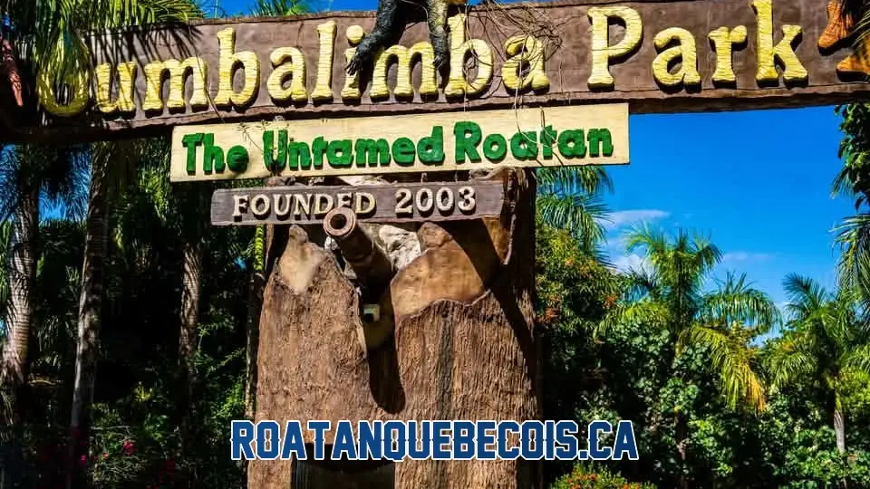 The entrance sign of Gumbalimba Park in Roatán, The Untamed Roatan, under the palm trees