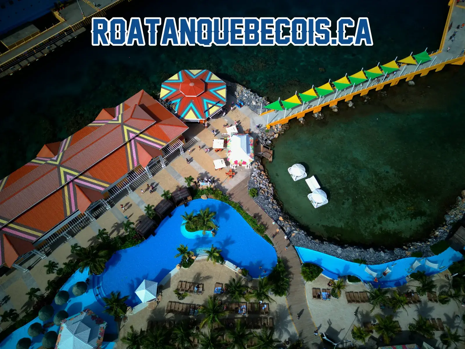 The central plaza of the Port of Roatán terminal, its painted roundel, the swimming pool and the canopied walkway