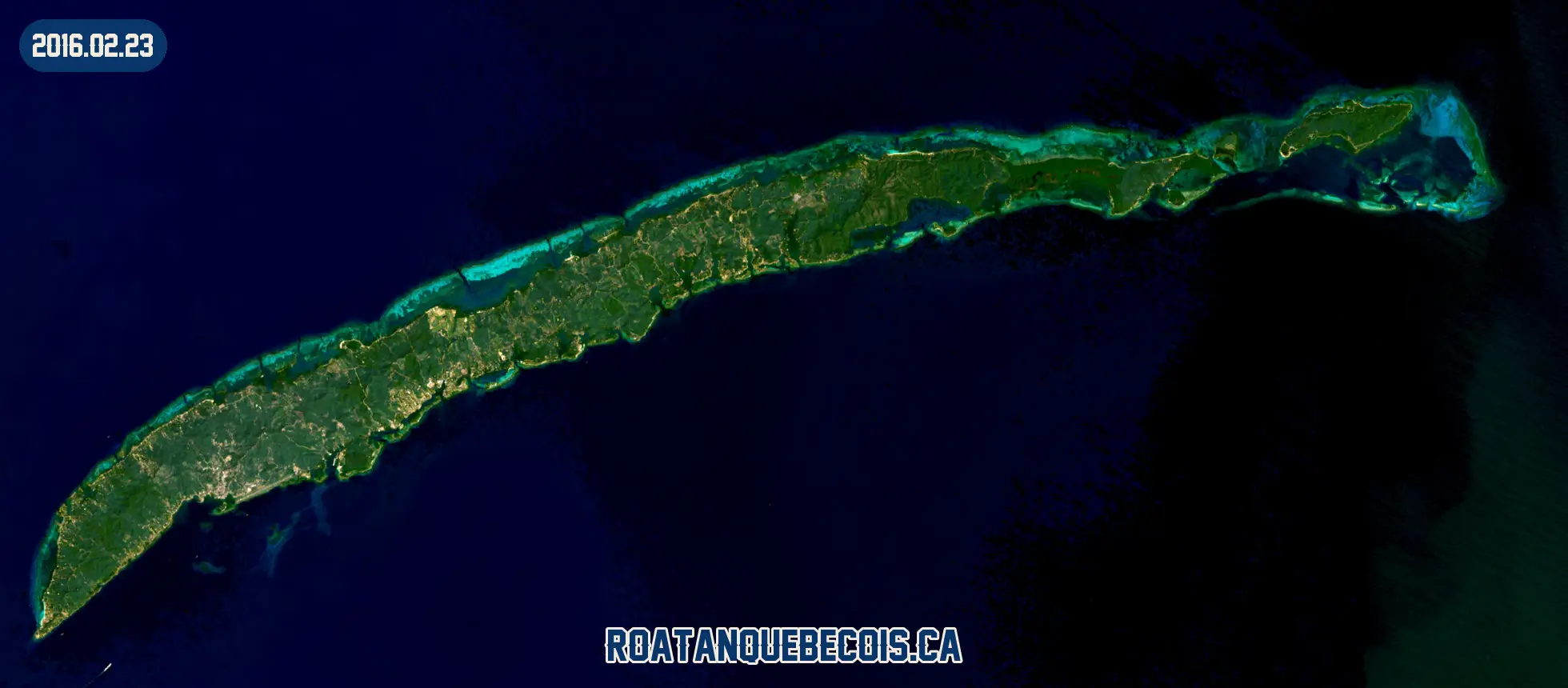 Roatán vue du ciel le 23 février 2016 : l'île entière, son récif et les zones bâties