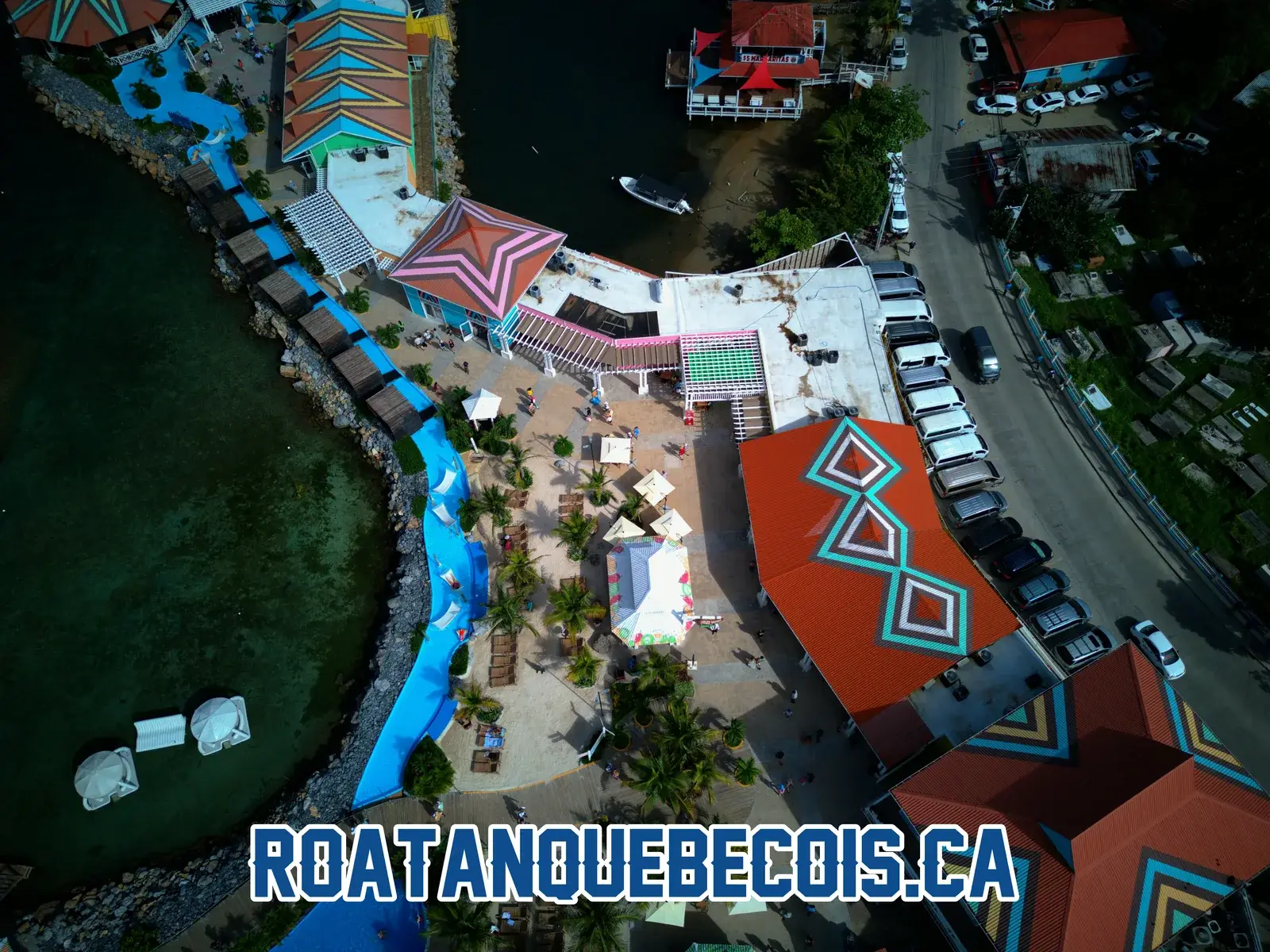 Terminal roofs at Port of Roatán, the lagoon channel and the car park alongside