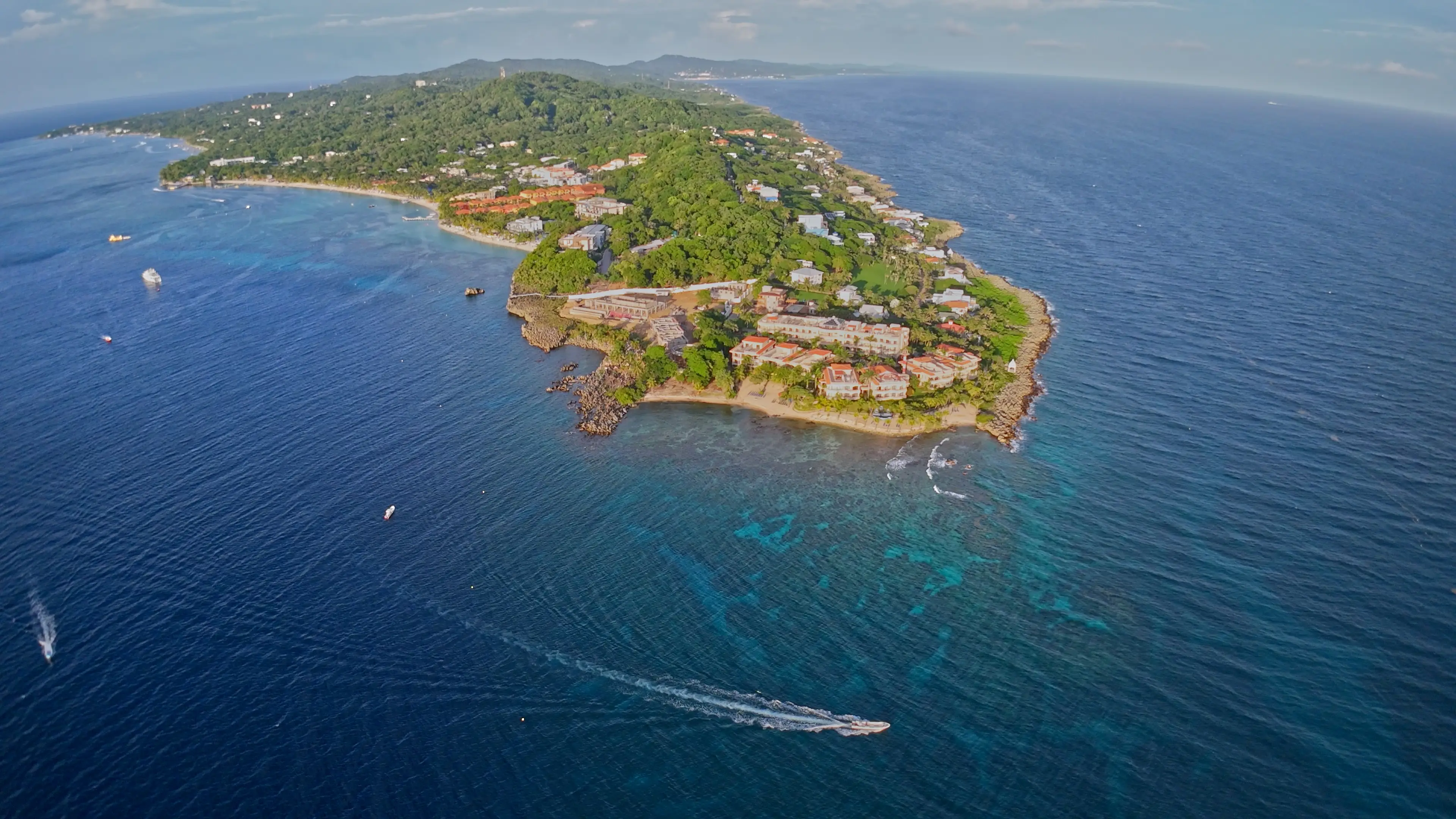 West Bay point from the air, turquoise water and the reef around it